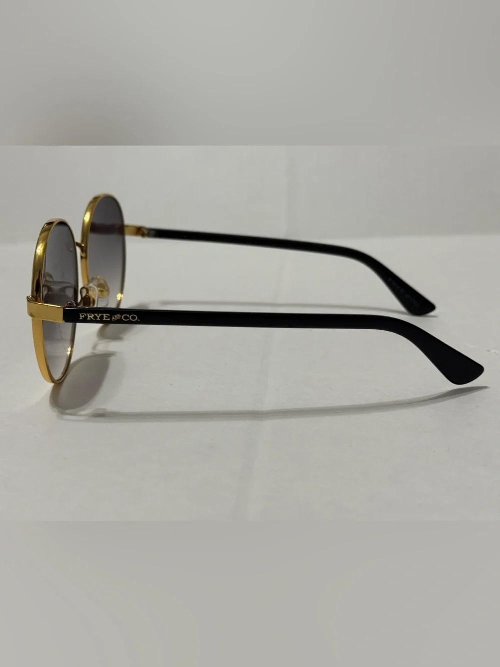 FRYE AND CO. Gold Round Sunglasses with Gradient Gray Lenses